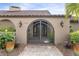 Close-up of the elegant arched entry gate at 1925 Jamaica Way, Punta Gorda, FL 33950