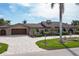 Front view of a charming home with a tile driveway at 1925 Jamaica Way, Punta Gorda, FL 33950