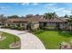 House exterior featuring a brown tile roof and landscaped yard at 1925 Jamaica Way, Punta Gorda, FL 33950