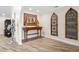 Spacious foyer featuring decorative accents, wood flooring, and a large mirror at 1925 Jamaica Way, Punta Gorda, FL 33950
