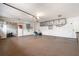 Organized garage with overhead storage and ample space at 1925 Jamaica Way, Punta Gorda, FL 33950
