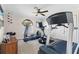 Well-equipped home gym featuring a treadmill, elliptical, and exercise bike at 1925 Jamaica Way, Punta Gorda, FL 33950