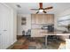 Bright home office features built-in wood cabinets, granite desk, and tile flooring at 1925 Jamaica Way, Punta Gorda, FL 33950