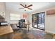 Home office with built-in desk, access to patio, and tile flooring at 1925 Jamaica Way, Punta Gorda, FL 33950