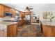 Bright kitchen featuring wood cabinets, granite countertops, and stainless steel appliances at 1925 Jamaica Way, Punta Gorda, FL 33950