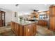 Large kitchen island with granite countertop and wine storage at 1925 Jamaica Way, Punta Gorda, FL 33950