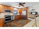 Modern kitchen with stainless steel appliances and wood cabinets at 1925 Jamaica Way, Punta Gorda, FL 33950