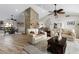 Spacious living room with stone fireplace and comfortable seating at 1925 Jamaica Way, Punta Gorda, FL 33950