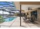 Relaxing pool area with covered patio and water views at 1925 Jamaica Way, Punta Gorda, FL 33950