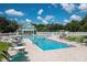 Resort-style pool with lounge chairs and a clubhouse at 19310 Water Oak Dr # 201, Port Charlotte, FL 33948