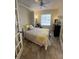 Guest bedroom with a Murphy bed and plenty of light at 19310 Water Oak Dr # 201, Port Charlotte, FL 33948