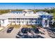 Aerial view of condo building with parking lot and surrounding landscape at 22375 Edgewater Dr # 254, Punta Gorda, FL 33980