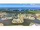 Expansive waterfront property featuring a home with a screened lanai pool and picturesque lake views at 24282 Silver Ln, Punta Gorda, FL 33955