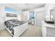 Cozy bedroom with white furniture, built-in closet, and workspace at 24282 Silver Ln, Punta Gorda, FL 33955
