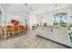 Open dining area with wooden table and access to living room at 24282 Silver Ln, Punta Gorda, FL 33955