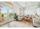 Bright and airy living room with seating and large windows at 24282 Silver Ln, Punta Gorda, FL 33955