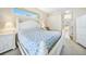 Spacious main bedroom with white furniture and en-suite bathroom at 24282 Silver Ln, Punta Gorda, FL 33955
