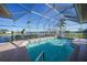 Inviting screened pool with open water views at 24282 Silver Ln, Punta Gorda, FL 33955