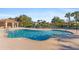 Community pool with plenty of seating and a covered area at 2764 Suncoast Lakes Blvd, Port Charlotte, FL 33980