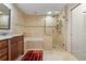Bathroom with soaking tub, walk-in shower, and granite vanity at 2813 Sancho Panza Ct, Punta Gorda, FL 33950