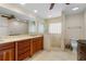Elegant bathroom with double vanity, large shower, and granite countertops at 2813 Sancho Panza Ct, Punta Gorda, FL 33950