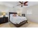 Bright bedroom with a king-size bed and ceiling fan at 2813 Sancho Panza Ct, Punta Gorda, FL 33950
