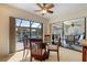 Bright breakfast nook with glass-top table and view of the pool and canal at 2813 Sancho Panza Ct, Punta Gorda, FL 33950