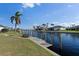 Private dock and steps leading to the water, offering stunning canal views at 2813 Sancho Panza Ct, Punta Gorda, FL 33950