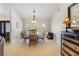 Elegant dining room with a marble table and ample natural light at 2813 Sancho Panza Ct, Punta Gorda, FL 33950