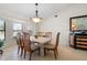 Bright dining room with a marble table and seating for six at 2813 Sancho Panza Ct, Punta Gorda, FL 33950