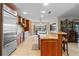 Open kitchen boasts granite countertops, stainless steel appliances, and island with seating at 2813 Sancho Panza Ct, Punta Gorda, FL 33950