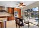 Kitchen with wood cabinets, granite countertops, and breakfast nook at 2813 Sancho Panza Ct, Punta Gorda, FL 33950
