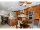 Eat-in kitchen with granite countertops, custom cabinetry, and stainless steel appliances at 2813 Sancho Panza Ct, Punta Gorda, FL 33950
