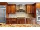 Modern kitchen with granite countertops, stainless steel appliances, and custom cabinetry at 2813 Sancho Panza Ct, Punta Gorda, FL 33950