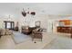 Spacious living room with a leather sectional sofa and hardwood floors at 2813 Sancho Panza Ct, Punta Gorda, FL 33950