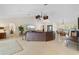 Spacious living area with tile floors, large sectional sofa, and views to dining area at 2813 Sancho Panza Ct, Punta Gorda, FL 33950