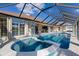 Inviting pool and spa with screened enclosure at 2813 Sancho Panza Ct, Punta Gorda, FL 33950