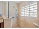 Large walk-in shower with glass enclosure and tile surround at 2813 Sancho Panza Ct, Punta Gorda, FL 33950