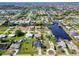 Aerial view of waterfront community with numerous houses and canals at 3021 Palm Dr, Punta Gorda, FL 33950