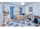 Cozy bedroom with a twin bed and nautical themed decor at 3021 Palm Dr, Punta Gorda, FL 33950