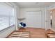 Well-lit bedroom with a rocking chair and large closet at 3021 Palm Dr, Punta Gorda, FL 33950
