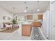 Bright kitchen with light wood cabinets and a large island at 3021 Palm Dr, Punta Gorda, FL 33950