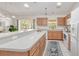 Well-equipped kitchen featuring wood cabinets and granite countertops at 3021 Palm Dr, Punta Gorda, FL 33950
