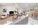 Open living room and kitchen with tile floors and neutral decor at 3021 Palm Dr, Punta Gorda, FL 33950