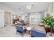 Cozy living room featuring comfortable seating and large window at 3021 Palm Dr, Punta Gorda, FL 33950