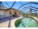 Screened-in pool and patio area with seating at 3021 Palm Dr, Punta Gorda, FL 33950