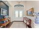 Bright and spacious foyer with hardwood floors and art at 3353 Sandpiper Dr, Punta Gorda, FL 33950