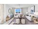 Relaxing living room with comfy sofas, a coffee table, and large windows at 5131 Schubert Trl, North Port, FL 34287