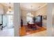 Bright dining room features hardwood floors, a large table, and a beautiful chandelier at 6416 Dunbarton St, North Port, FL 34291