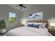 Bedroom with king-size bed, window, and art pieces at 10404 Monticello Dr, Port Charlotte, FL 33981